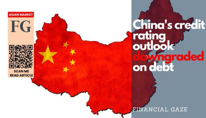 China's credit rating outlook downgraded on debt